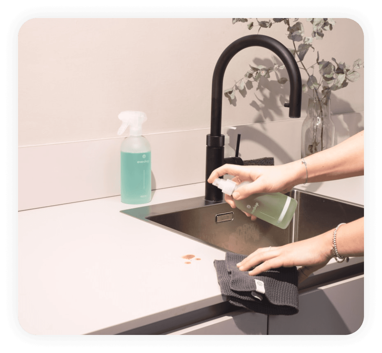 Person cleaning countertop