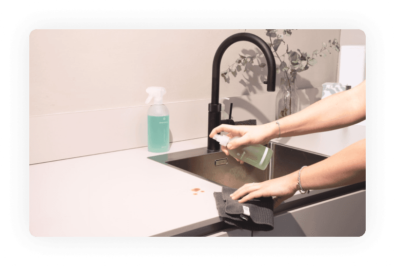 Person cleaning countertop